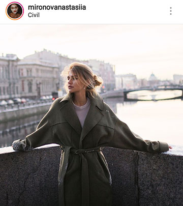 Idées de photos d'automne pour instagram - une fille sur un pont dans un manteau
